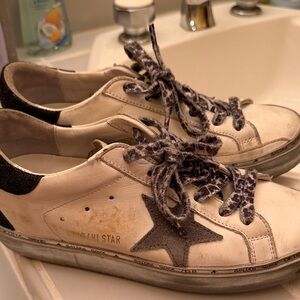 Golden Goose Cream and Black Star Sneakers